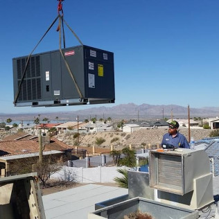 HVAC technician repairing an air conditioning system